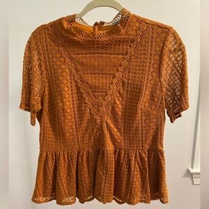 Orange peplum top, lightly worn, size L